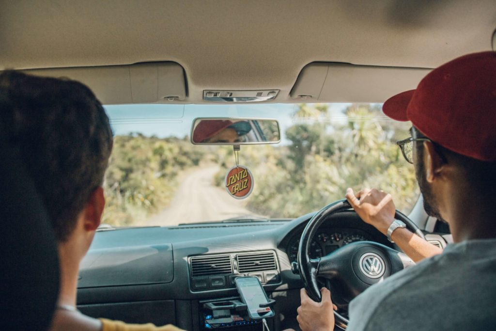 Two people driving a car